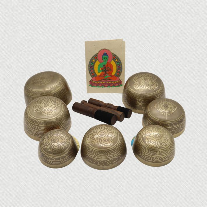 7 set of meditation singing bowl with wooden stick on it
