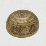 Tibetan Singing Bowl with prayer carved in it.