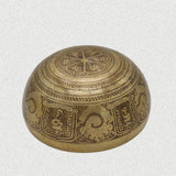 tibetan healing singing bowl with prayers written on it