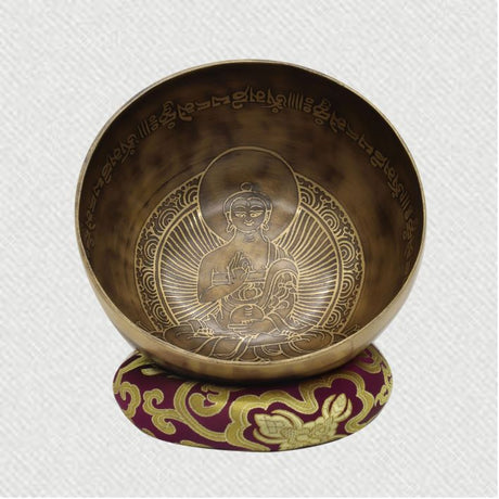 tibetan singing bowl with buddha carving for healing