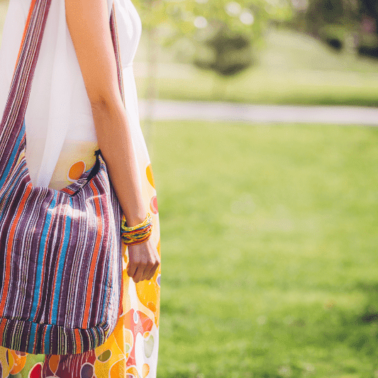 colorful boho hippie bags worn by a girl