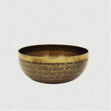 old tibetan singing bowl with wooden mallet