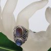 adjustable artistic handcrafted sterling silver ring with double labradorite gemstone