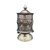 tibetan prayer wheel with mantra carved on